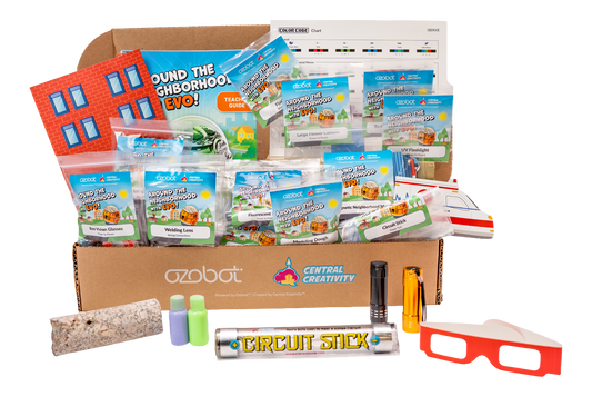 Educational toy kit with various components including a cardboard box labeled 'Central Creativity' and 'Ozobot'.