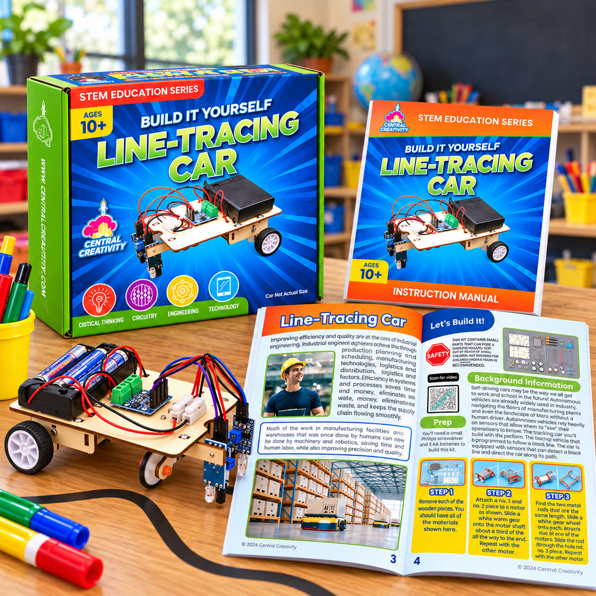 The Line Tracing Car beside its retail box and the illustrated instruction manual, opened.