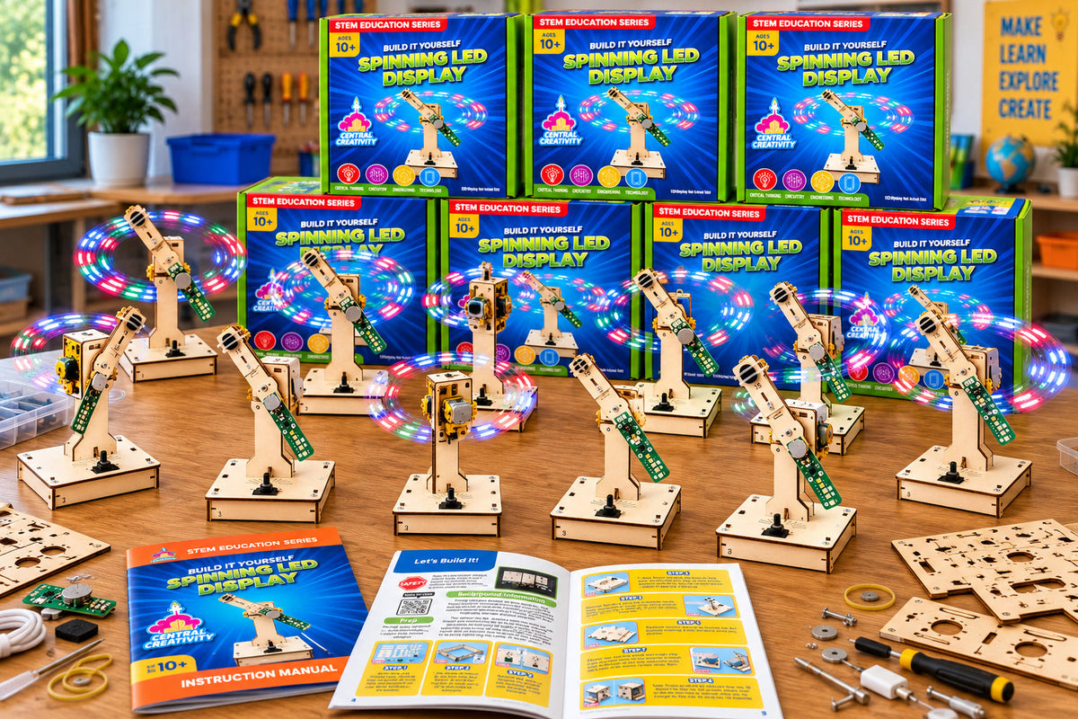 A classroom table of assembled Spinning LED Displays, their light arms tracing circles of color