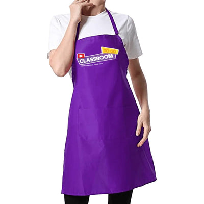 The purple Classroom TO GO instructor apron worn over a white t-shirt, photographed against a plain background.