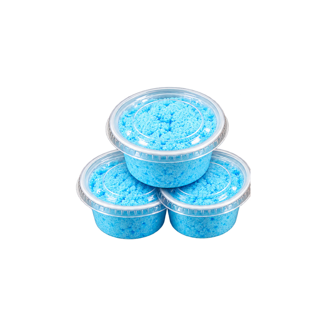 Three cups of finished blue bath bomb mixture with clear lids, stacked.