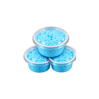 Three cups of finished blue bath bomb mixture with clear lids, stacked.