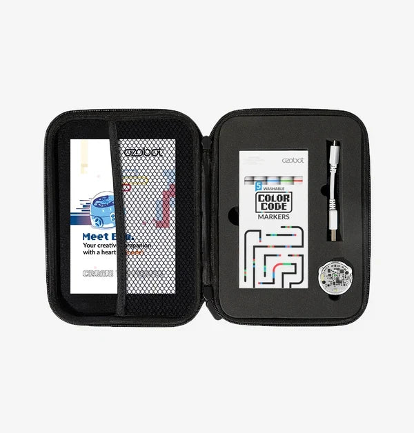 The Entry Kit case open: the Meet Evo guide behind a mesh pocket on the left, and on the right the Color Code marker box, a white charging cable and the Evo robot in its molded cut-out.