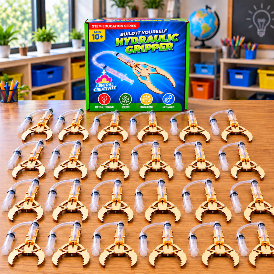 A classroom table of assembled Hydraulic Grippers, built and ready for a session