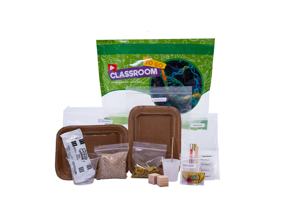 A green Classroom TO GO life science unit bag with its activity bags laid out in front of it