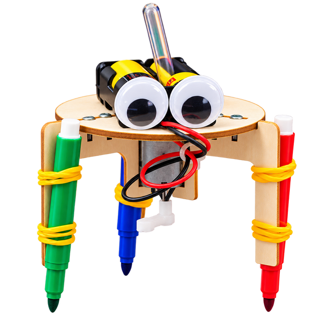 The assembled Art Bot: a plywood disc on three legs, a colored marker banded to each leg, two large googly eyes and the motor and battery pack on top.