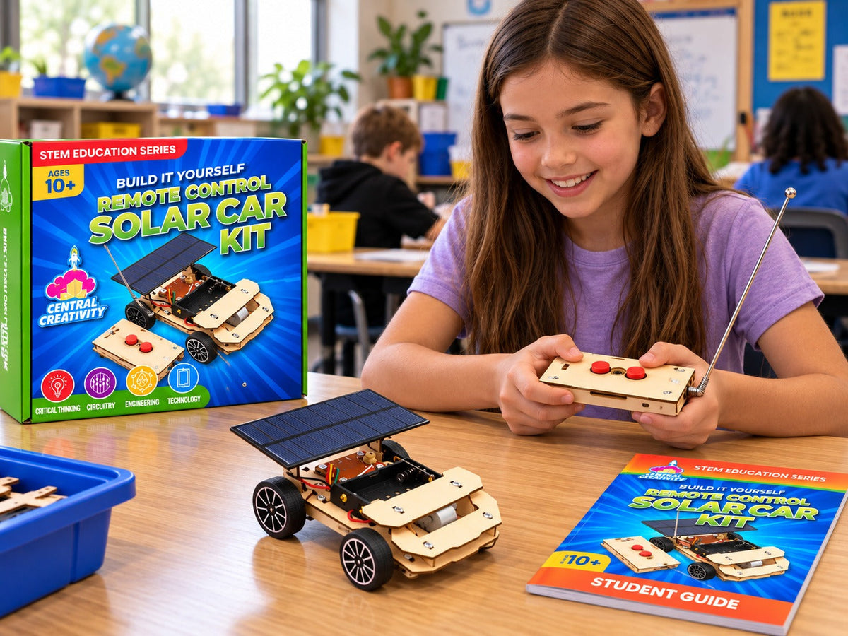 A girl at a classroom desk driving the finished solar car with the wooden remote, the kit box and the student guide beside her