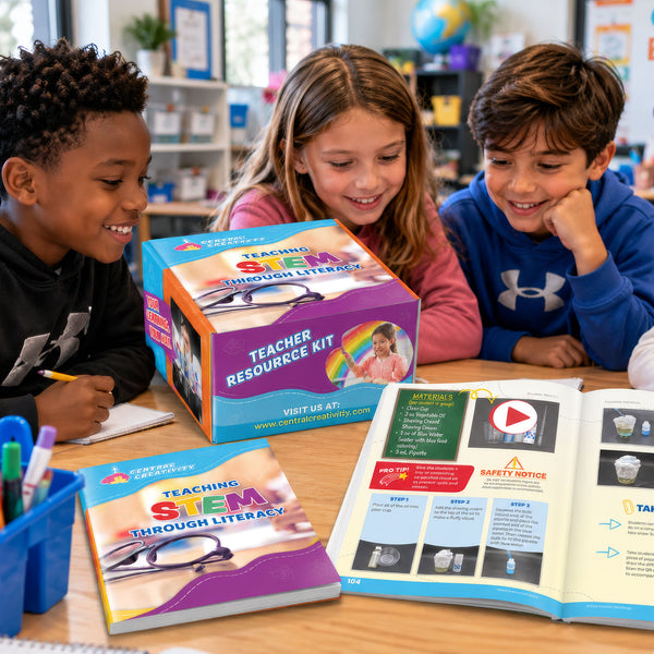 Three elementary students lean over a classroom table around the Teaching STEM Through Literacy Teacher Resource Kit box, with the teacher guide closed beside it and a second copy open to an illustrated activity spread.