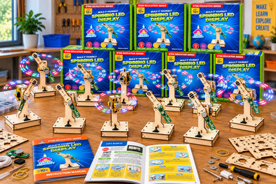 A classroom table of assembled Spinning LED Displays, their light arms tracing circles of color