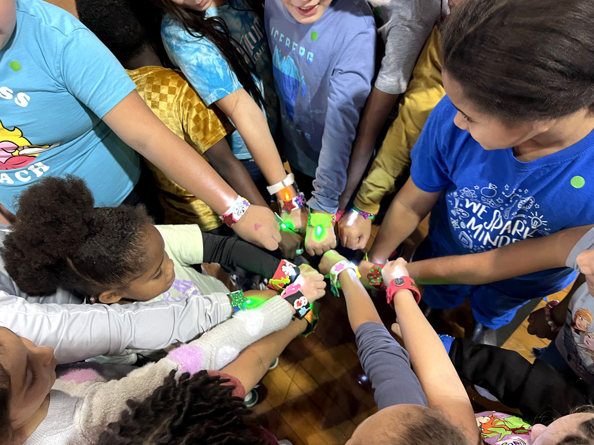 Campers at a NASA ASTRO CAMP TO GO Club session, mid-build at the table