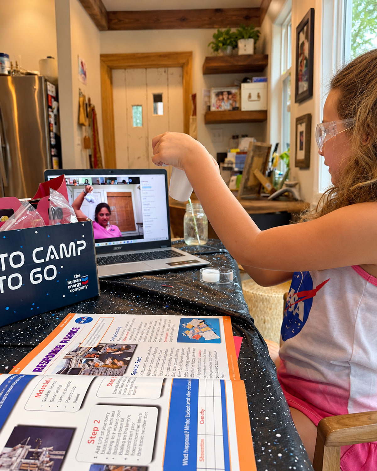 A family working through a Central Creativity kit at home