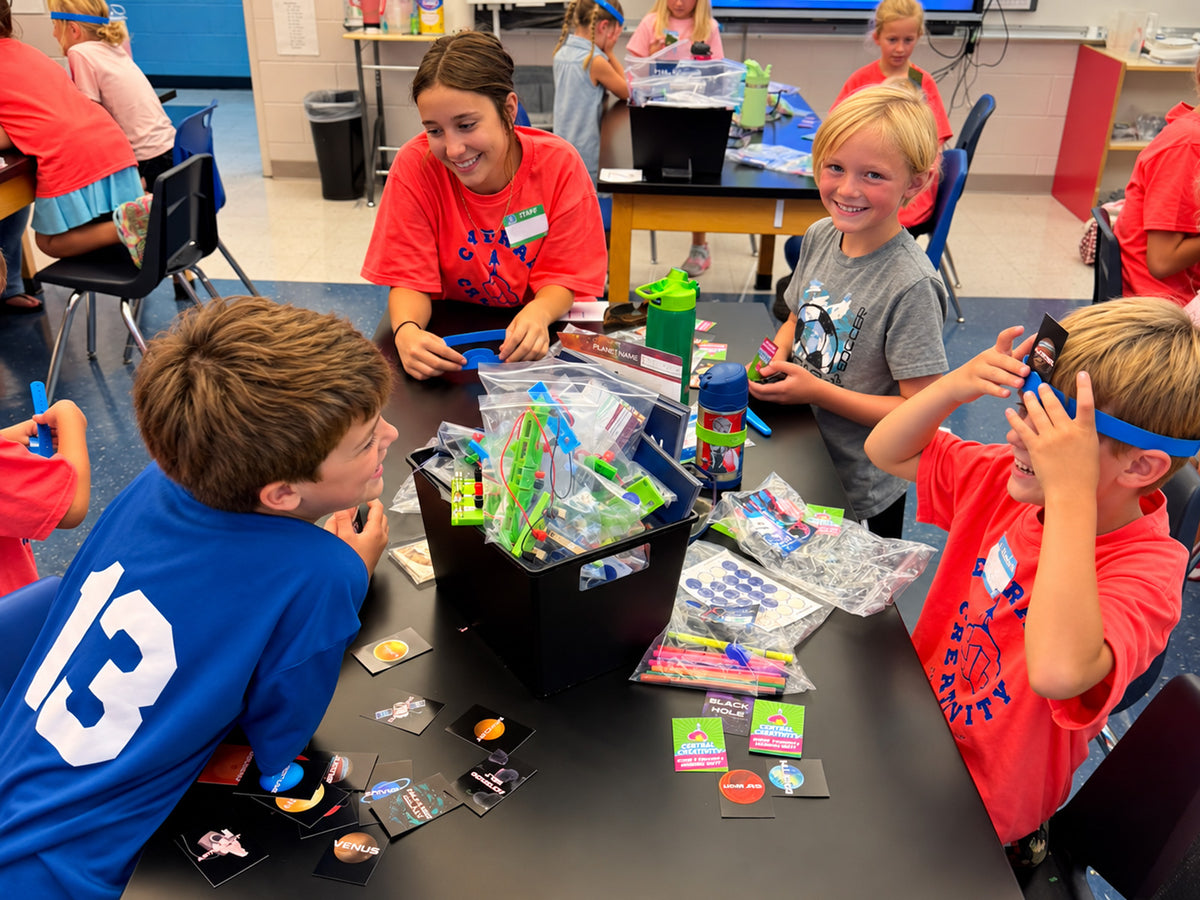 Children and a Central Creativity facilitator mid-activity at a session in Louisville